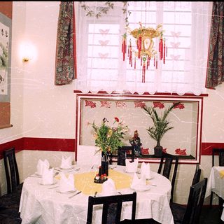 Elegant restaurant dining area with Asian decor.