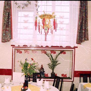 Elegant restaurant dining area with Asian decor.