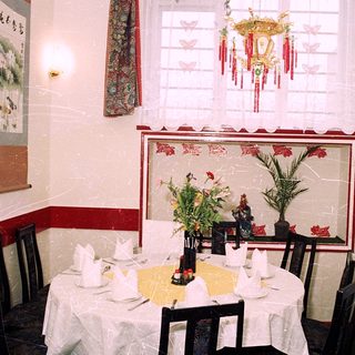 Elegant restaurant dining area with Asian decor.