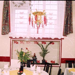 Elegant restaurant dining area with Asian decor.