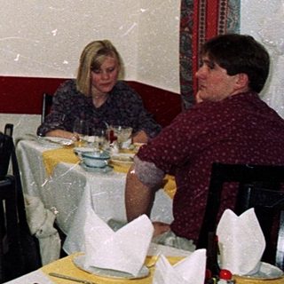 Asian-themed restaurant with diners at tables.