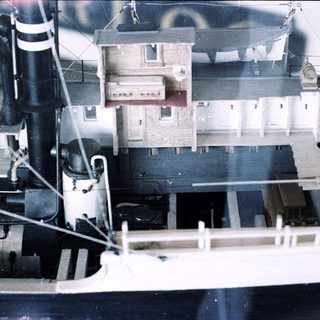 Miniature model of an old ship interior.