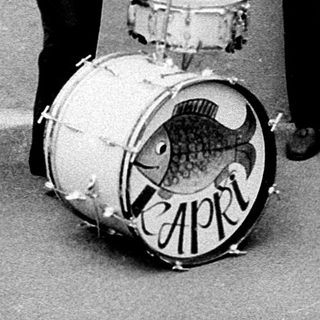 Street band playing instruments outdoors.