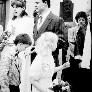 Family gathering outside a church entrance.