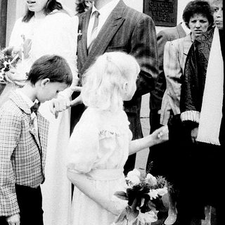 Family gathering outside a church entrance.