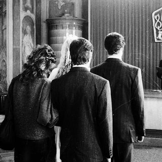 Wedding ceremony with bride, groom, and officiant.
