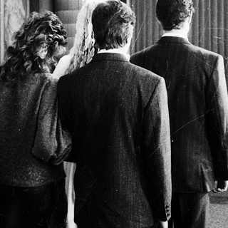 Wedding ceremony with bride, groom, and officiant.