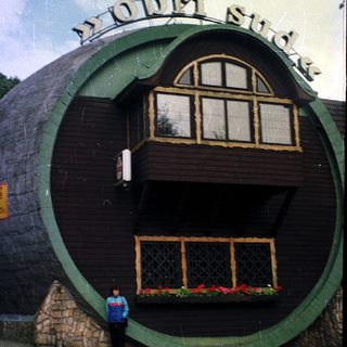 Whimsical building shaped like a giant ring.