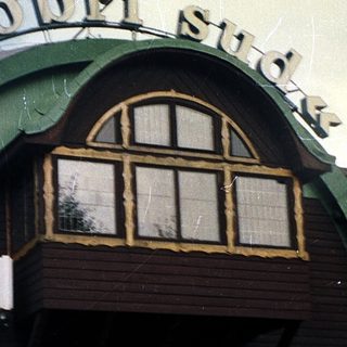 Whimsical building shaped like a giant ring.