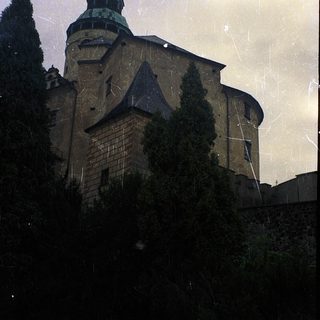 Historic stone church with towered architecture.