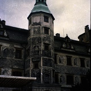 Historic castle tower with intricate stone carvings.