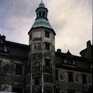 Historic castle tower with intricate stone carvings.