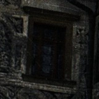 Historic castle tower with intricate stone carvings.
