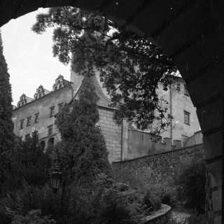 Historic castle illuminated at dusk.