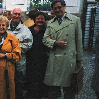 Group of people posing outdoors in 1970s-style clothing.