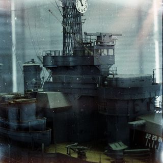 War-era battleship with prominent clock tower.