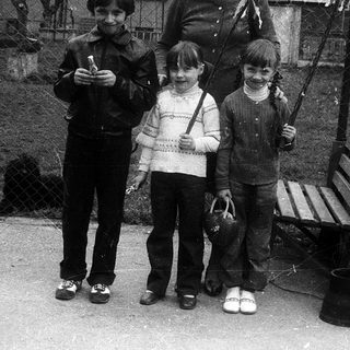 Family group photo outdoors in winter clothing.