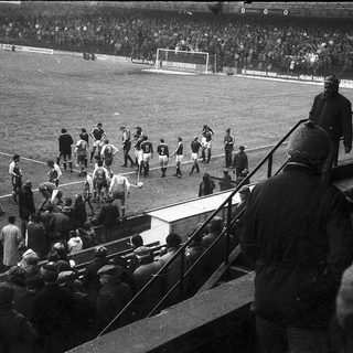Pre-match team warm-up on soccer field.