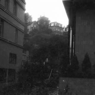 Narrow alleyway between old European buildings.