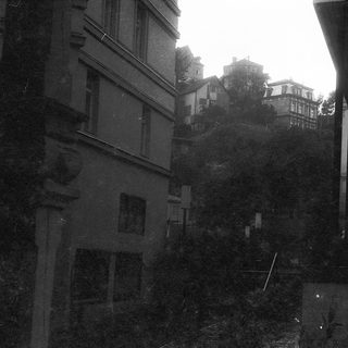 Narrow alleyway between old European buildings.