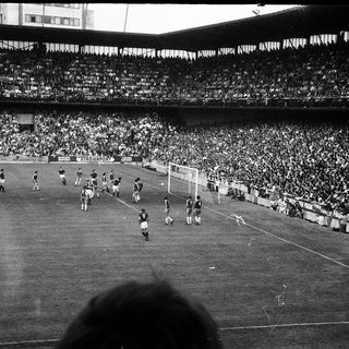 Historic soccer match with packed stadium.