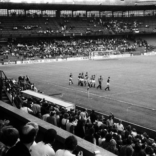 Classic soccer match with full stadium.