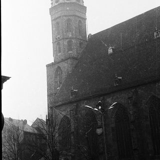 Historic church tower with Gothic architectural details.