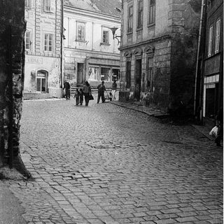 Historic cobblestone street with old European architecture.