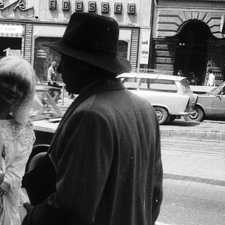 People on city street during wedding.