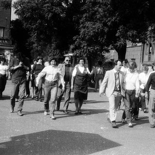 People participating in a street protest march.