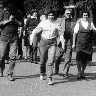 People participating in a street protest march.