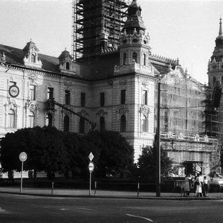 Historic building under restoration with scaffolding.