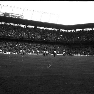 Large stadium filled with spectators during a sports event.