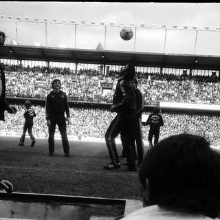 Pre-kickoff ceremony at a large stadium.