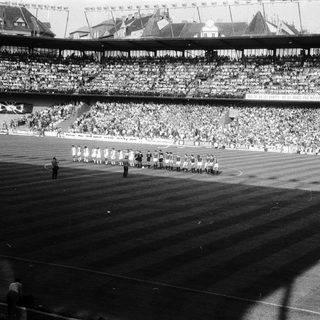 Ceremonial march at large stadium event.