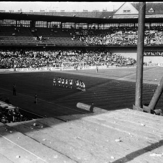 Historic soccer match with large crowd.
