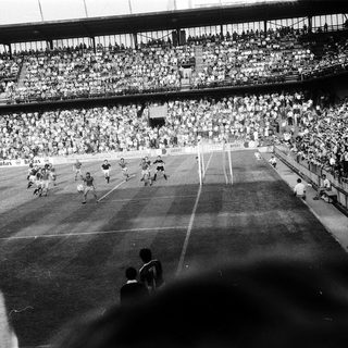Historic soccer match with packed stadium.
