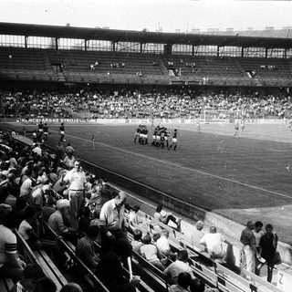 Historic soccer match with packed stadium.