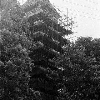 Multi-tiered pagoda under scaffolding for restoration.
