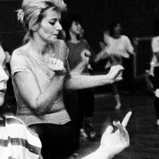 Women participating in a dance or movement exercise class.
