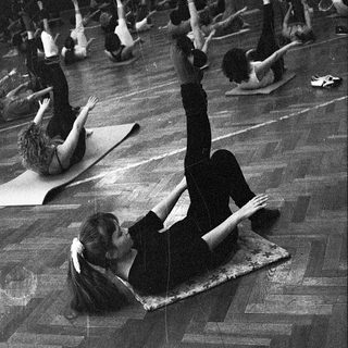 Group yoga or stretching class in progress.
