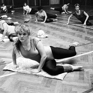 Women participating in a yoga or stretching class.