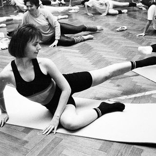 Group yoga or stretch class in progress.