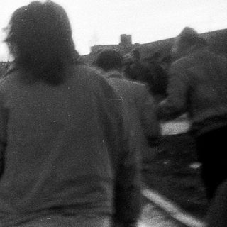 People walking together outdoors in winter.