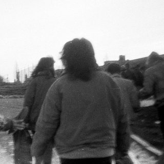 People walking together outdoors in winter.