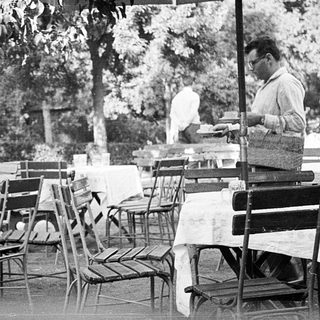 People dining outdoors at a café.