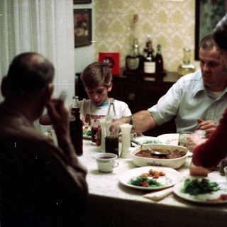 Family sharing meal together indoors.