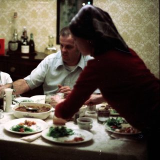 Family sharing meal together indoors.