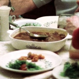 Family sharing meal together indoors.