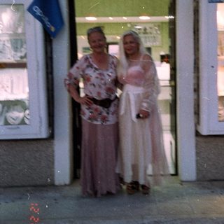 Two women posing outside "Zlatarna Vili" jewelry shop.